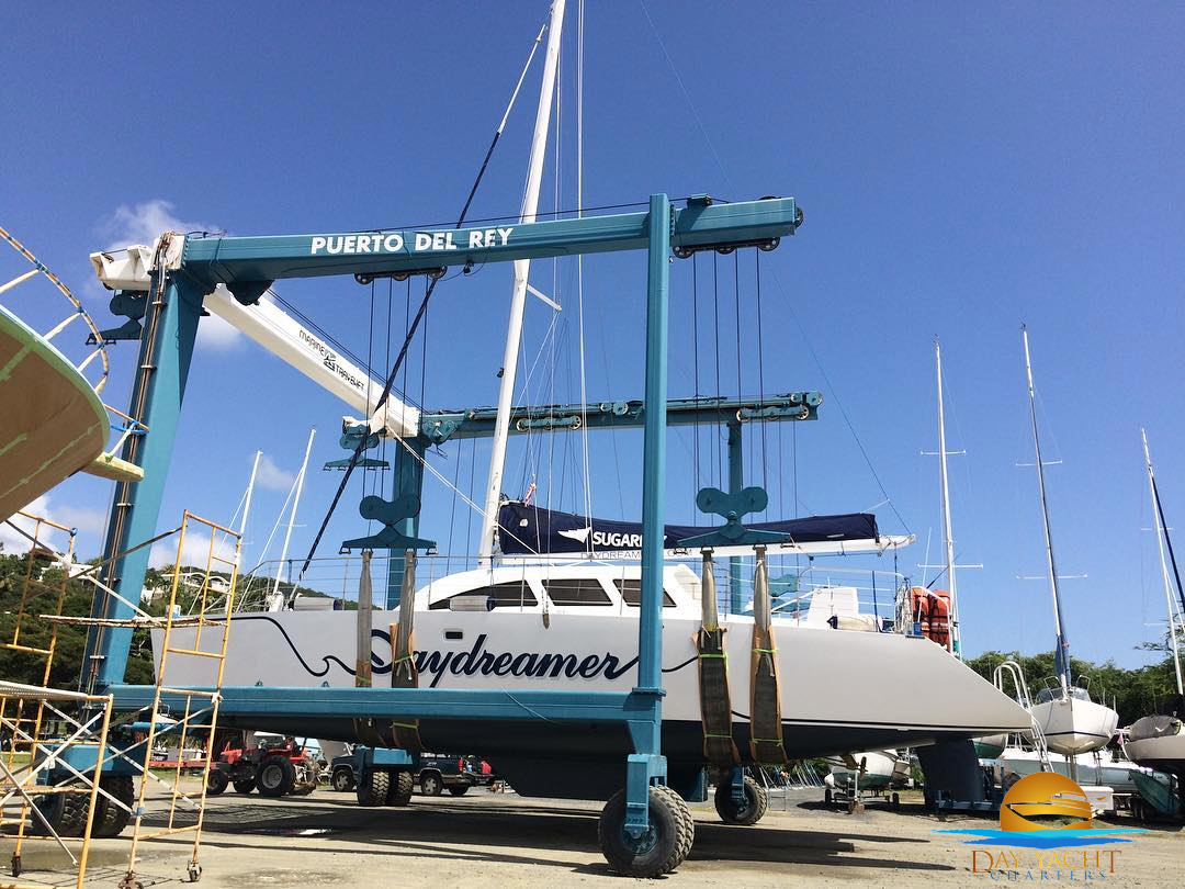 Yacht bow cutting through deep blue water, Puerto del Rey Marina Fajardo